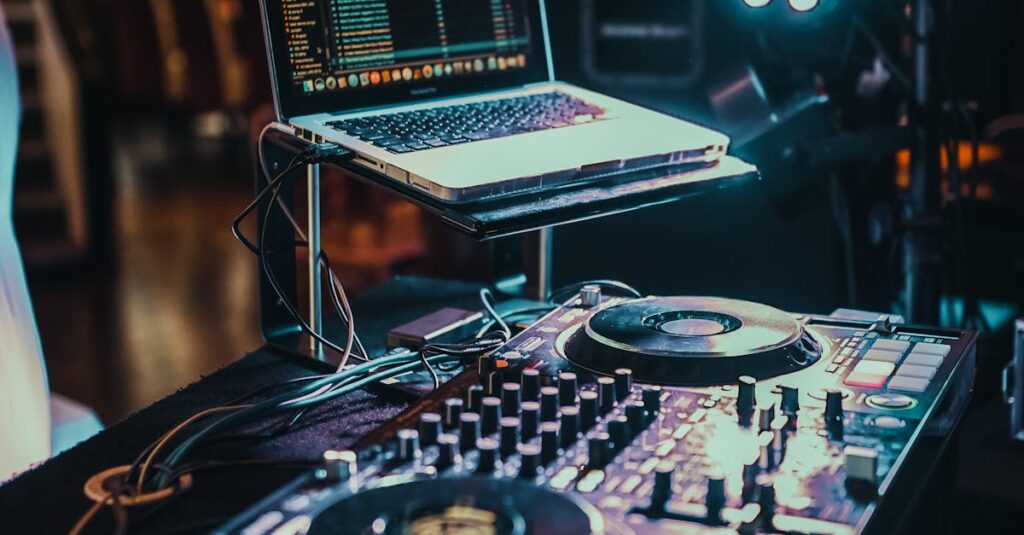 A vibrant indoor DJ booth with a laptop and music controller ready for use.